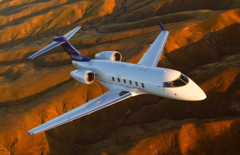 Challenger 300 Aircraft Flying Over Mountains